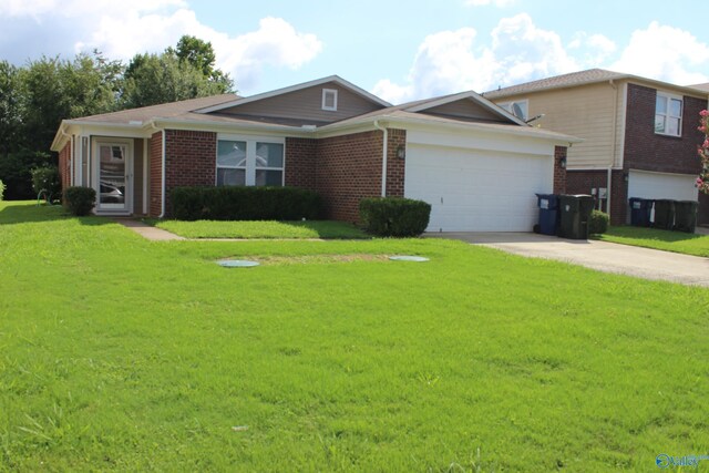 ranch-style house with a garage and a front lawn