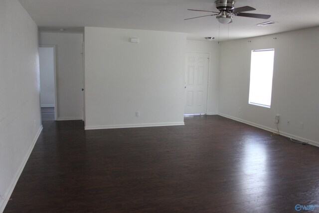 living room with wood-type flooring and ceiling fan