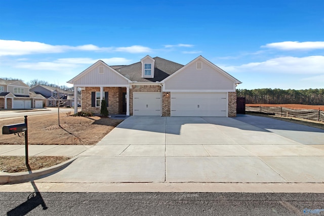 craftsman house featuring concrete driveway, brick siding, and an attached garage