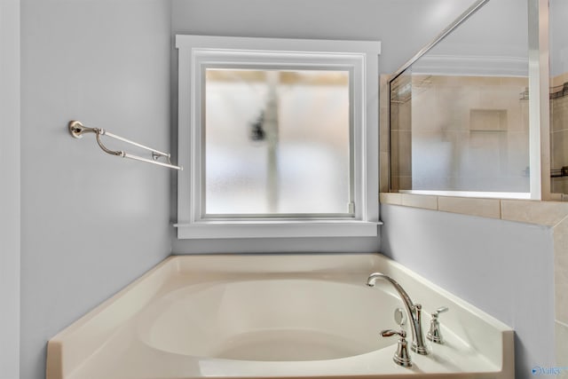 full bathroom featuring a garden tub
