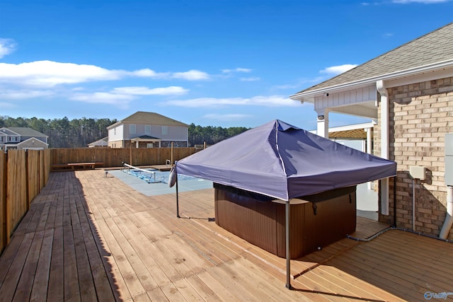 deck with a fenced backyard