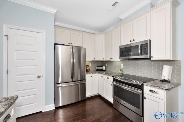 119 Autumn Cove Dr, Madison, AL 35756 - kitchen with stainless steel appliances, crown molding, dark wood-type flooring, backsplash, and light stone countertops
