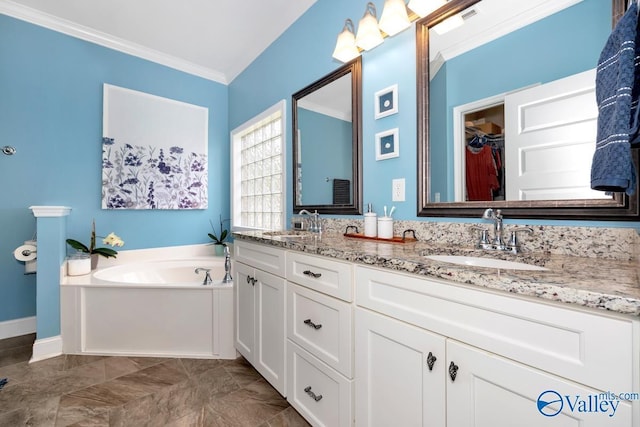 119 Autumn Cove Dr, Madison, AL 35756 - bathroom with double vanity, crown molding, a garden tub, a spacious closet, and marble finish floors