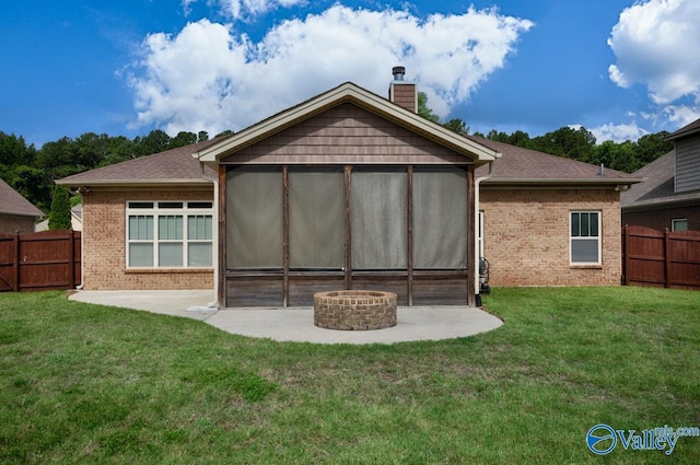 119 Autumn Cove Dr, Madison, AL 35756 - back of house with a patio, an outdoor fire pit, brick siding, and a chimney