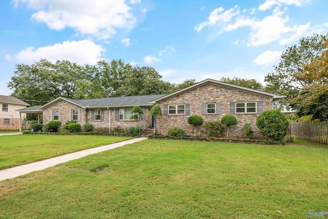 ranch-style home with a front lawn