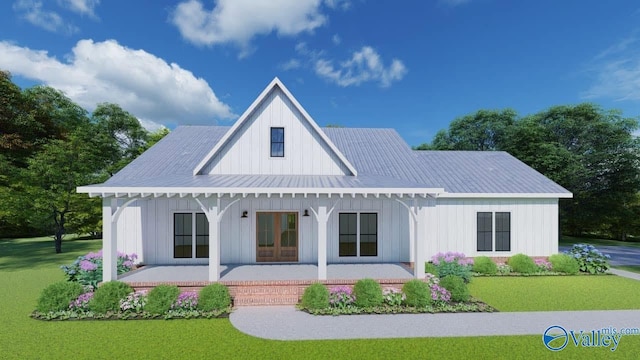 193 Bush Rd, Huntsville, AL 35803 - back of house with covered porch, board and batten siding, a yard, and a metal roof