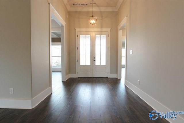 entryway with dark hardwood / wood-style floors and french doors