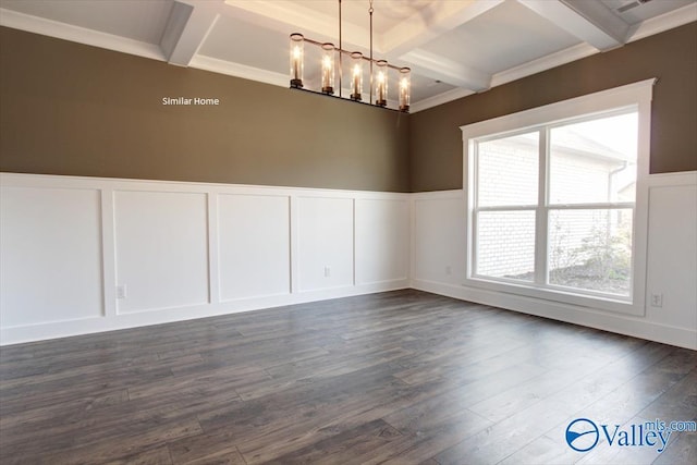 empty room featuring coffered ceiling, a notable chandelier, beam ceiling, and dark wood-type flooring