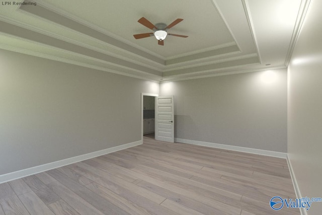 spare room featuring crown molding, light hardwood / wood-style flooring, a raised ceiling, and ceiling fan