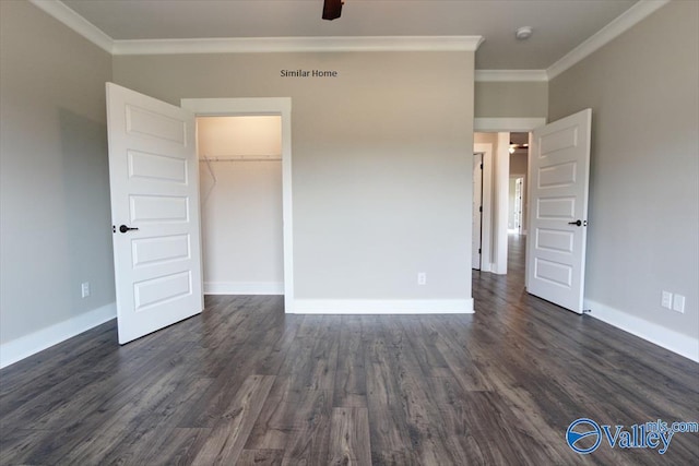 unfurnished bedroom featuring ornamental molding, dark wood-type flooring, and a closet