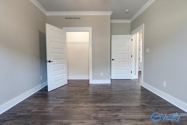 unfurnished bedroom with ornamental molding, dark hardwood / wood-style floors, and a closet