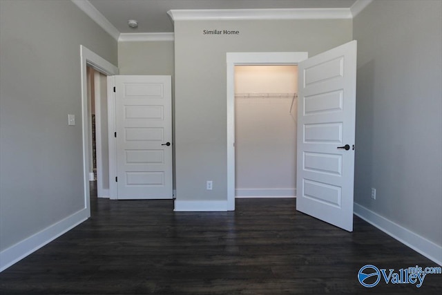 unfurnished bedroom with crown molding, dark wood-type flooring, and a closet