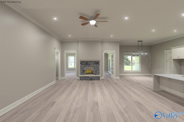 unfurnished living room featuring crown molding, a fireplace, and light hardwood / wood-style flooring