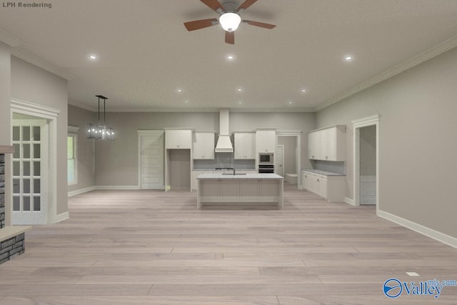 kitchen featuring custom exhaust hood, appliances with stainless steel finishes, pendant lighting, a kitchen island with sink, and white cabinets