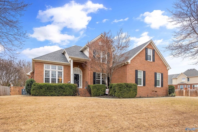 view of property featuring a front lawn