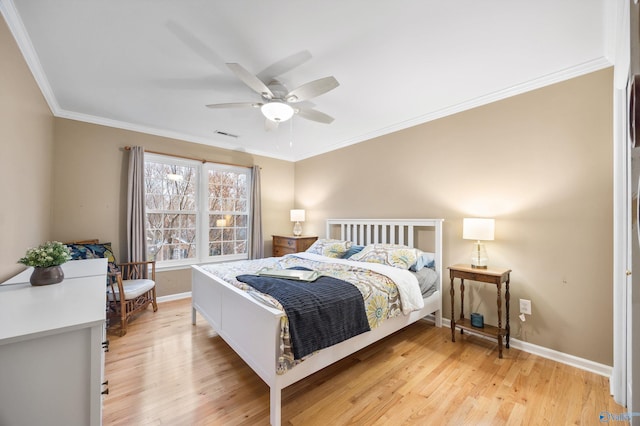 bedroom featuring light wood-type flooring, ceiling fan, and ornamental molding