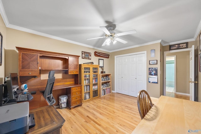 office area with light hardwood / wood-style flooring, ceiling fan, and ornamental molding