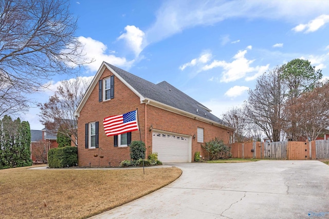 view of home's exterior featuring a lawn and a garage