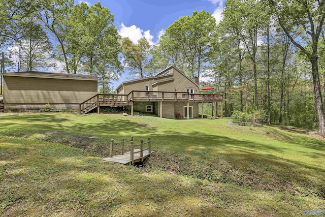 view of yard with stairway and a wooden deck