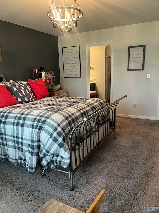 carpeted bedroom featuring a notable chandelier and ensuite bath