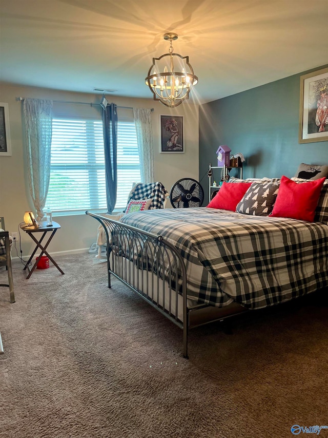 carpeted bedroom with a notable chandelier