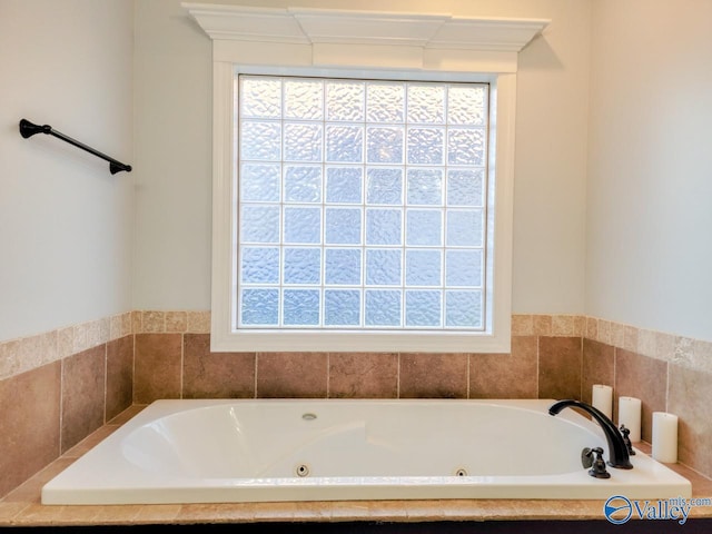 full bathroom featuring a jetted tub