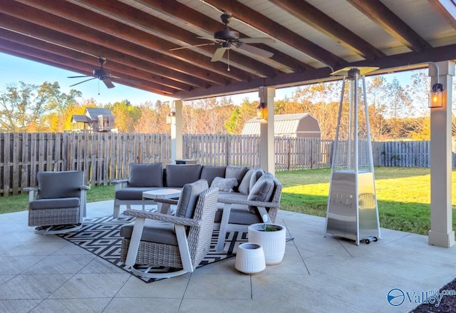 view of patio with a fenced backyard, ceiling fan, and an outdoor hangout area