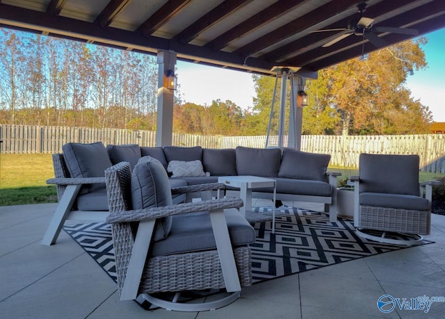 view of patio featuring ceiling fan, a fenced backyard, and an outdoor living space