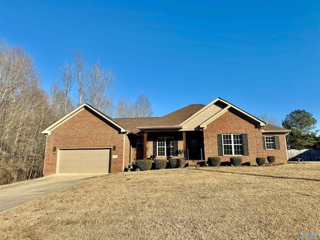 ranch-style home with a garage and a front yard