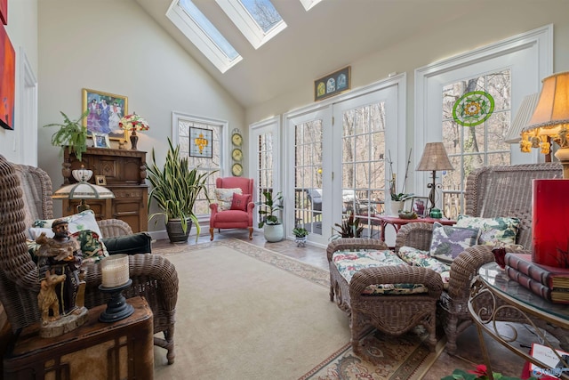 living room with a skylight, plenty of natural light, and high vaulted ceiling