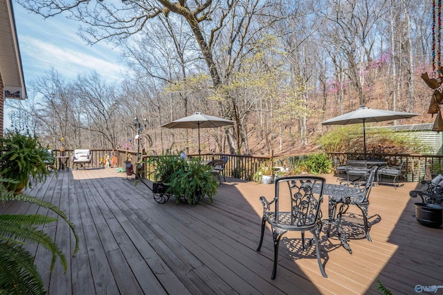wooden deck with outdoor dining area