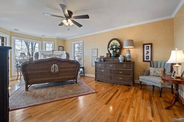 bedroom featuring baseboards, wood finished floors, a ceiling fan, and ornamental molding