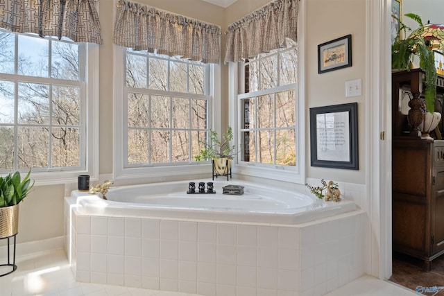 bathroom featuring a bath and tile patterned flooring
