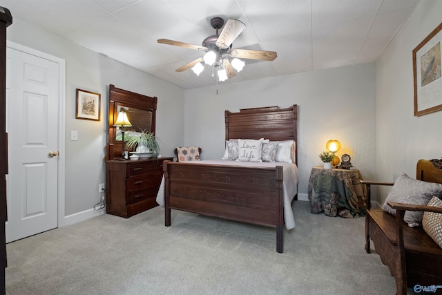 bedroom featuring baseboards, carpet, and a ceiling fan