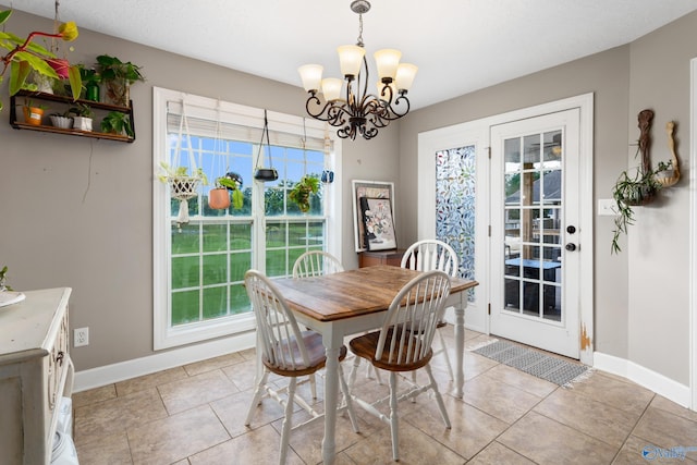 1465 Marshall Way, Southside, AL 35907 - dining area featuring a chandelier, baseboards, and light tile patterned floors