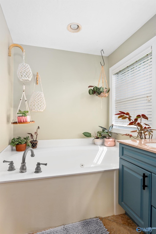 1465 Marshall Way, Southside, AL 35907 - bathroom with vanity, a whirlpool tub, and tile patterned floors