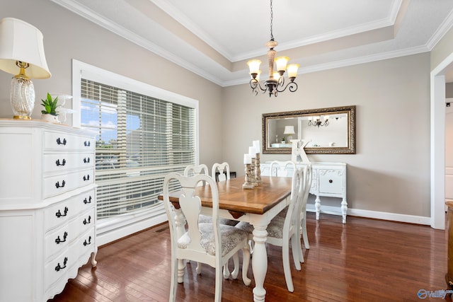 1465 Marshall Way, Southside, AL 35907 - dining room featuring a chandelier, dark wood-type flooring, a raised ceiling, and ornamental molding