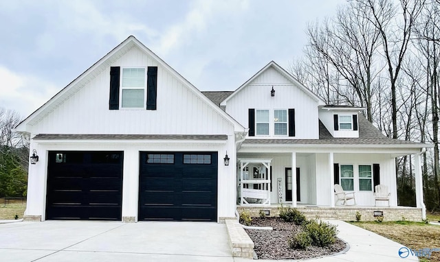 modern farmhouse style home featuring a porch and a garage