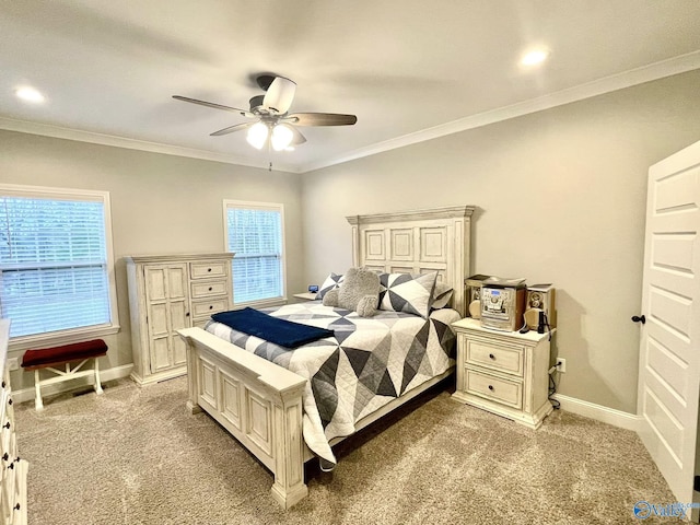 bedroom with ornamental molding, light colored carpet, and ceiling fan