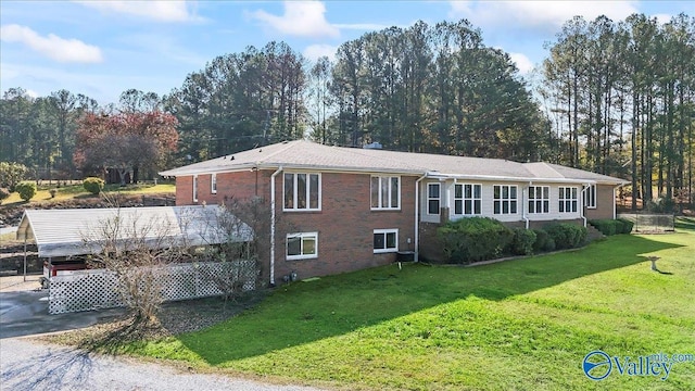 rear view of house with a yard