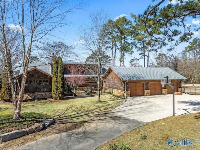 view of front of house with stone siding, metal roof, and a front yard