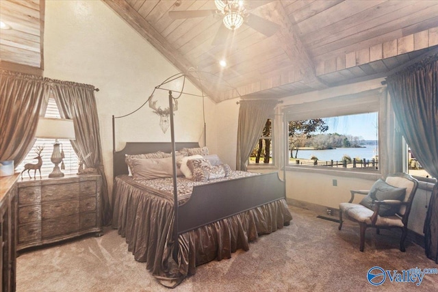 bedroom featuring a water view, wood ceiling, light carpet, and multiple windows