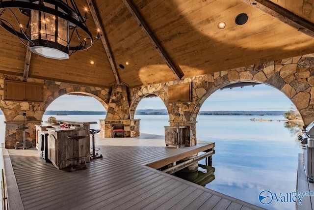 view of dock with a water view and outdoor dry bar