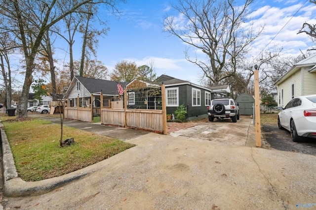 view of front facade featuring a storage shed