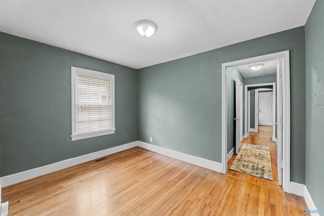 unfurnished room featuring light wood-type flooring