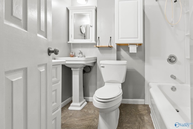 bathroom featuring shower / washtub combination, tile patterned flooring, and toilet