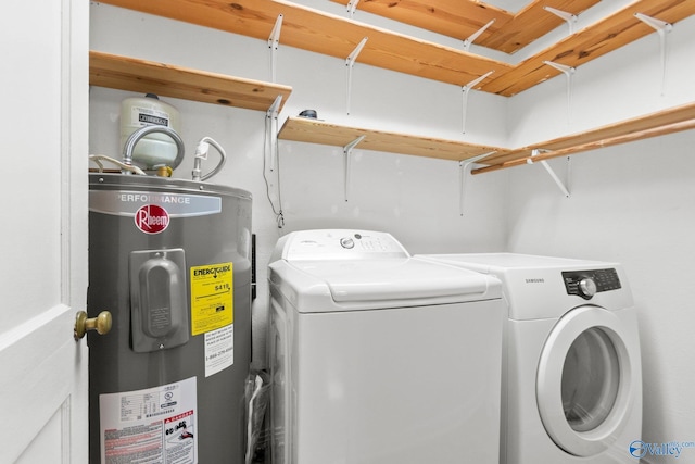 clothes washing area with independent washer and dryer and electric water heater