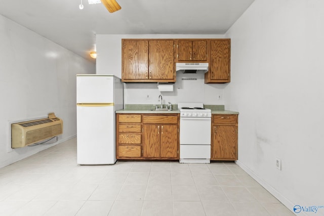 kitchen featuring ceiling fan, sink, a wall mounted AC, white appliances, and light tile patterned flooring