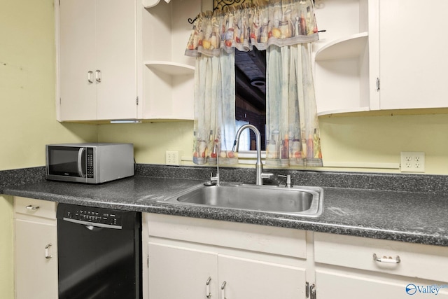 kitchen with black dishwasher, white cabinetry, and sink