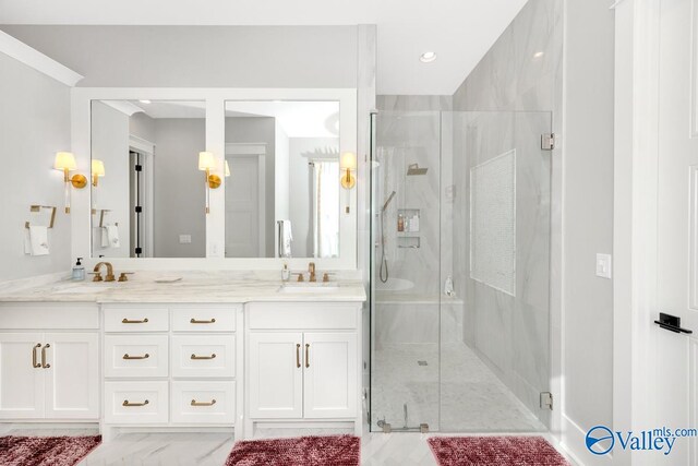 bathroom with walk in shower and vanity